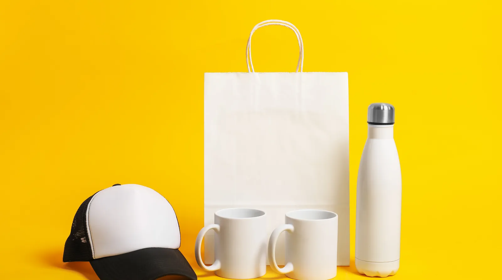 Blank cap, mugs, paper bag and drink bottle ready for branding
