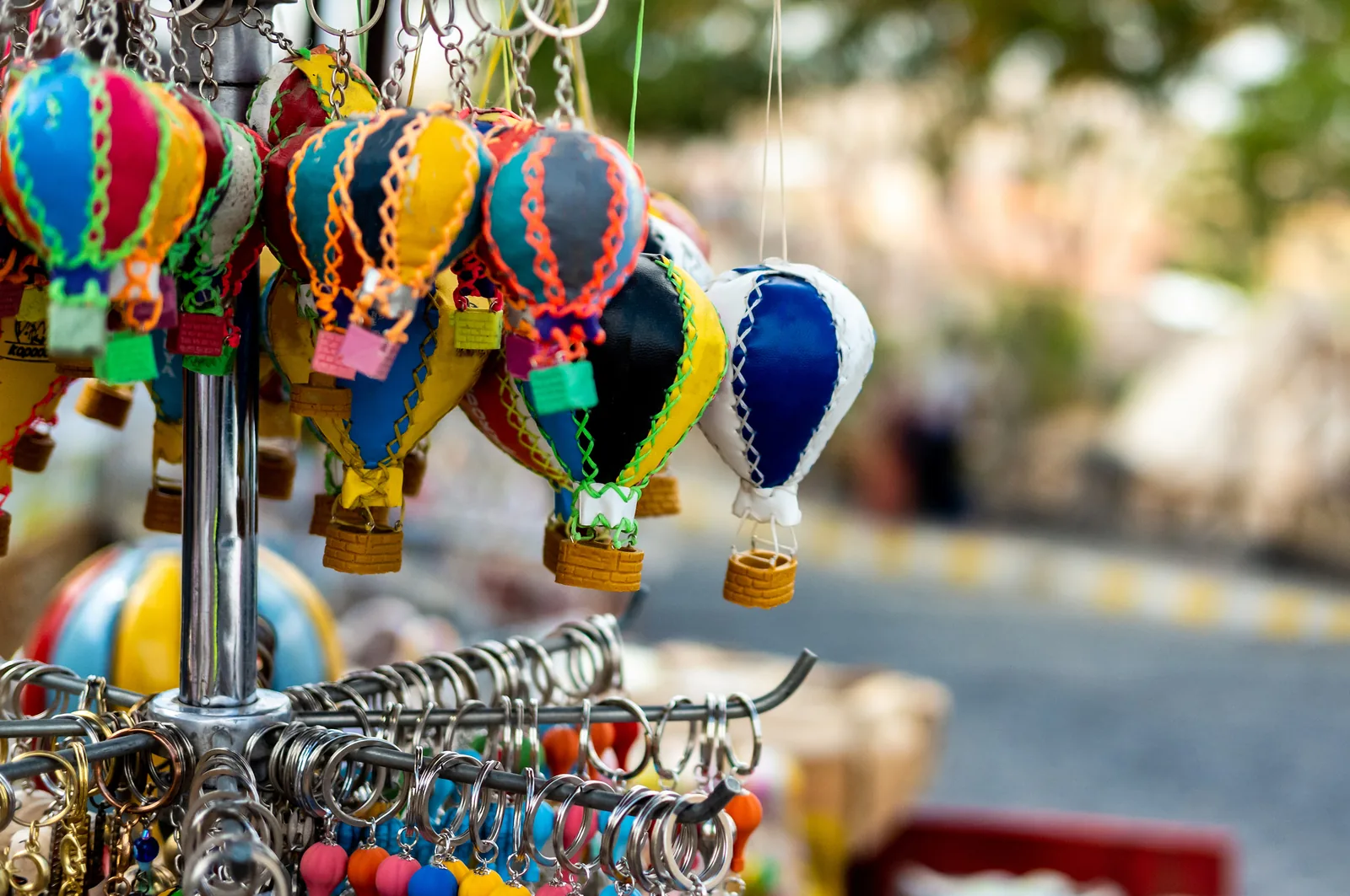 Miniature hot-air-balloon souvenirs on a market stand