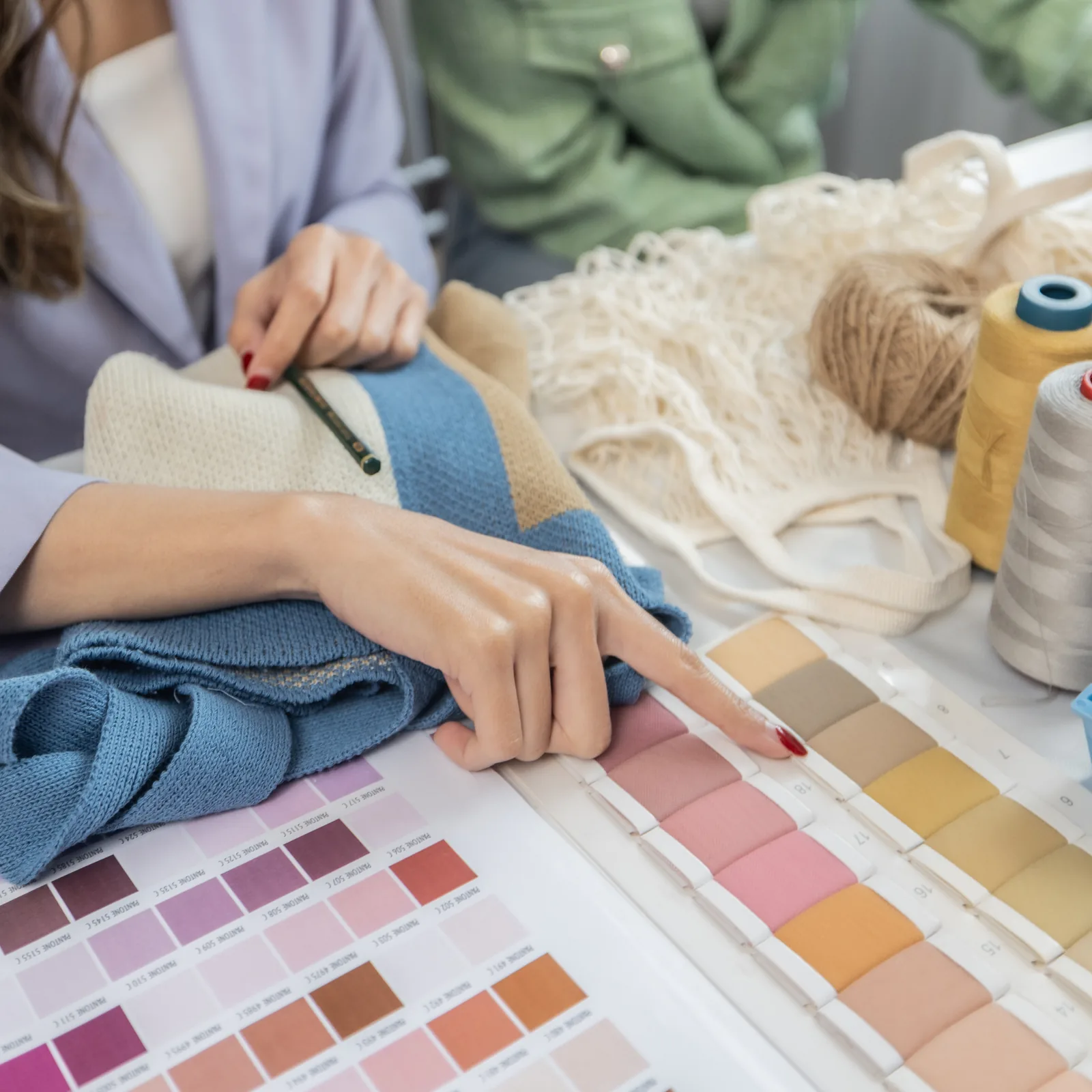 Designer choosing colours from a swatch card