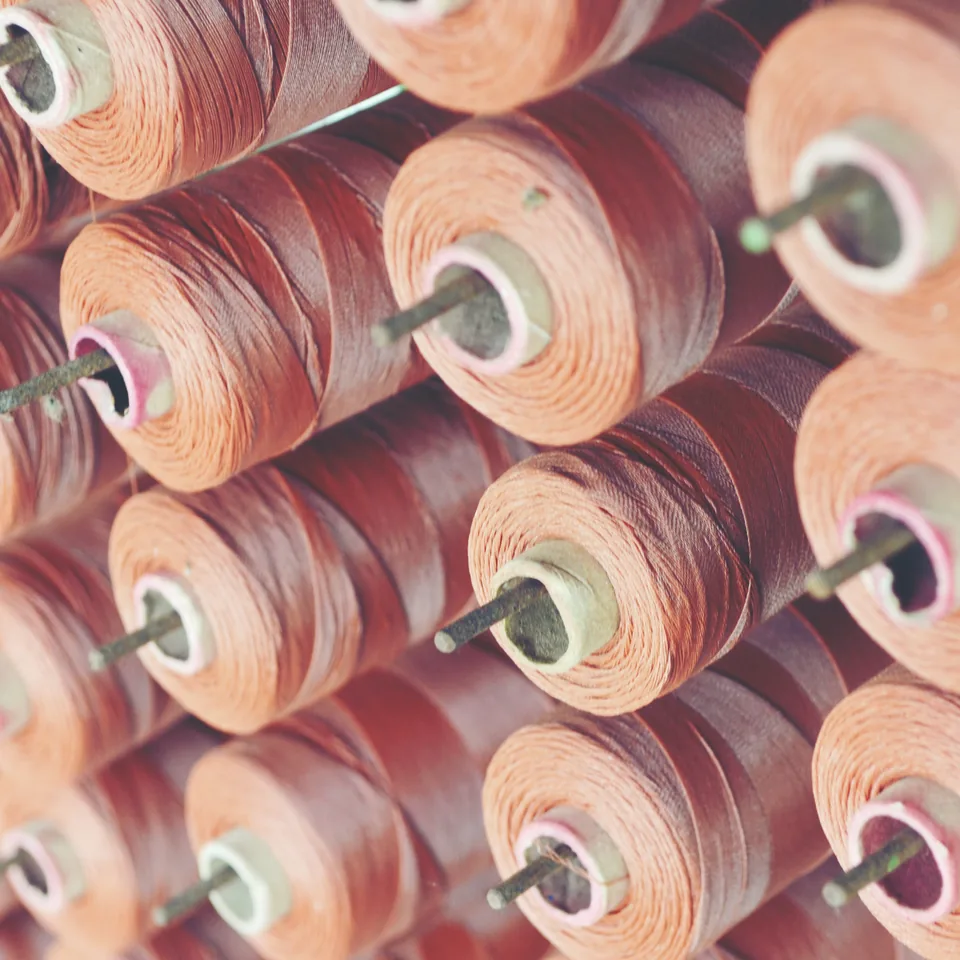 Thread cones loaded on a factory rack